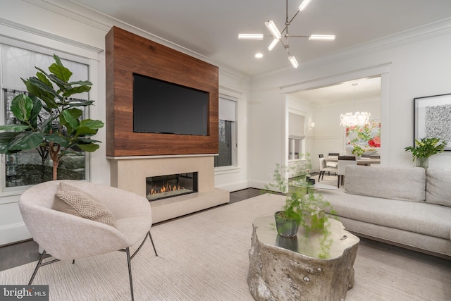 2022 Rockingham St, Mclean, VA 22101 - living room with a chandelier, wood finished floors, a glass covered fireplace, ornamental molding, and recessed lighting