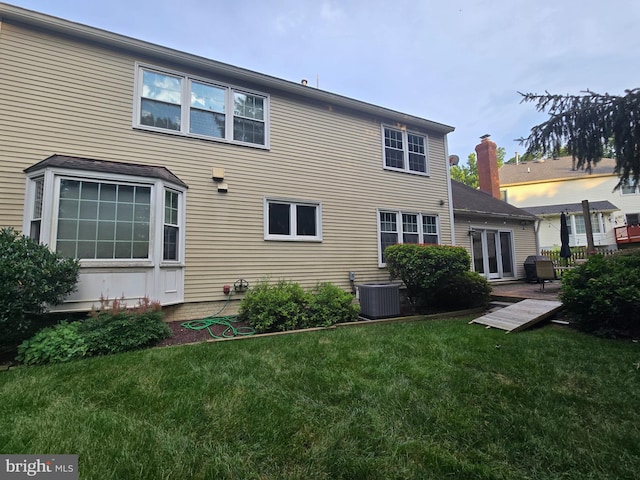 8604 Cherry Dr, Fairfax, VA 22031 - back of property featuring a lawn and a patio