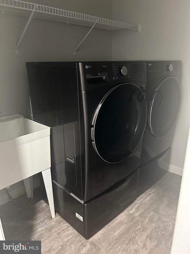655 Morris Ave, Newfield, NJ 08344 - laundry room with independent washer and dryer and wood finished floors