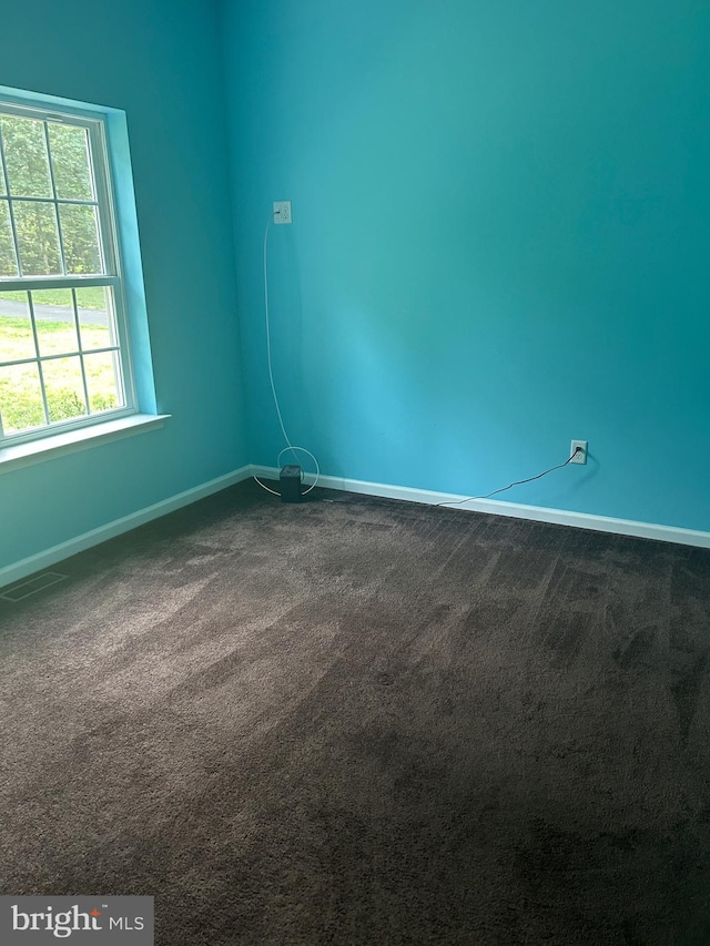 655 Morris Ave, Newfield, NJ 08344 - spare room with baseboards and dark carpet