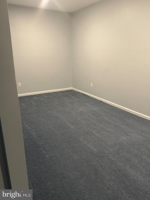 655 Morris Ave, Newfield, NJ 08344 - empty room with baseboards and dark colored carpet