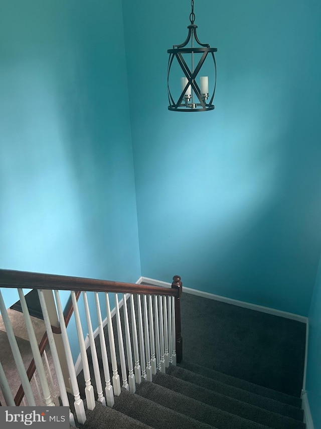 655 Morris Ave, Newfield, NJ 08344 - staircase with carpet floors and a chandelier