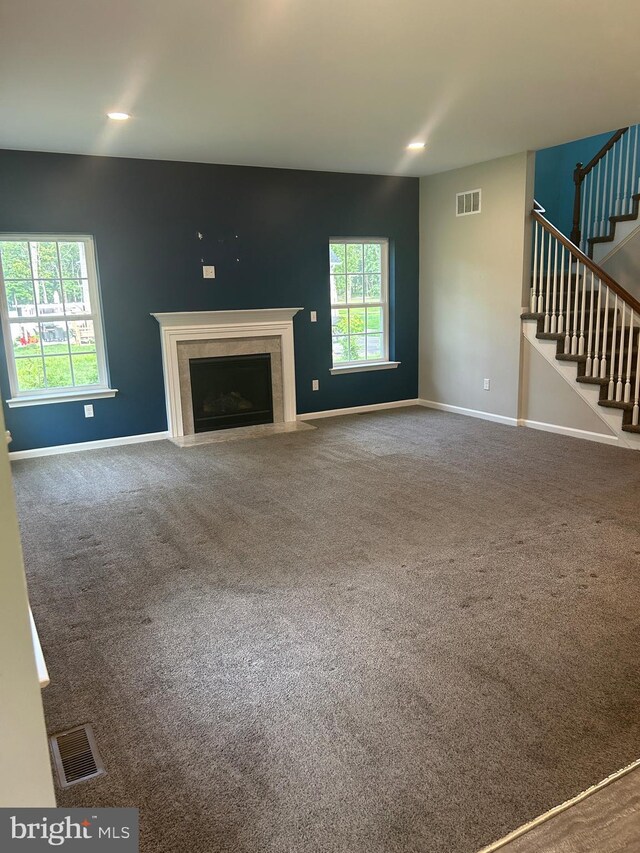 655 Morris Ave, Newfield, NJ 08344 - unfurnished living room with stairs, a premium fireplace, carpet floors, and recessed lighting