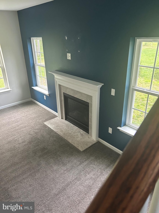 655 Morris Ave, Newfield, NJ 08344 - unfurnished living room featuring a tiled fireplace and carpet floors
