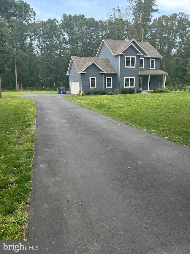 655 Morris Ave, Newfield, NJ 08344 - colonial home featuring driveway, a front lawn, and a garage