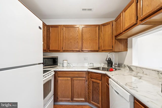 5116 Aberdeen Dr, Mount Laurel, NJ 08054 - kitchen featuring white appliances and brown cabinets