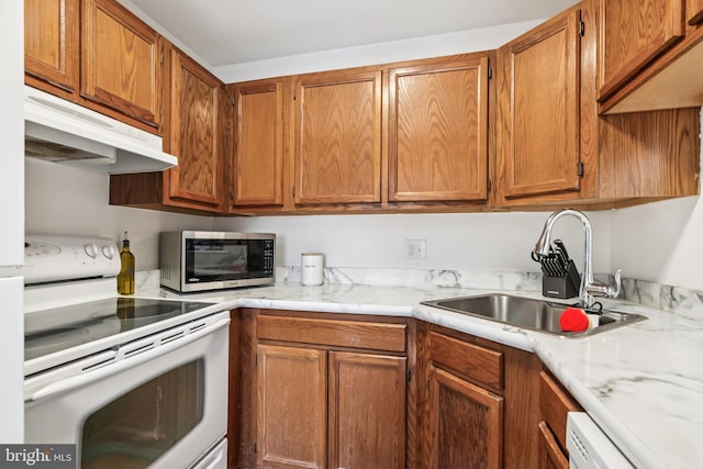 5116 Aberdeen Dr, Mount Laurel, NJ 08054 - kitchen with white appliances, under cabinet range hood, and brown cabinets