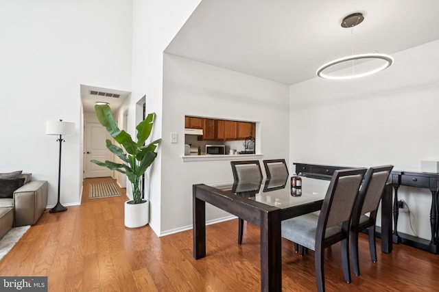 5116 Aberdeen Dr, Mount Laurel, NJ 08054 - dining room featuring wood finished floors and baseboards