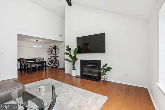 5116 Aberdeen Dr, Mount Laurel, NJ 08054 - living room with wood finished floors, a glass covered fireplace, and high vaulted ceiling