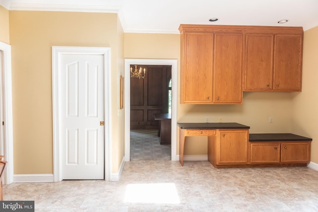 160 Fox Rd, Palmyra, PA 17078 - kitchen with crown molding, dark countertops, and brown cabinetry