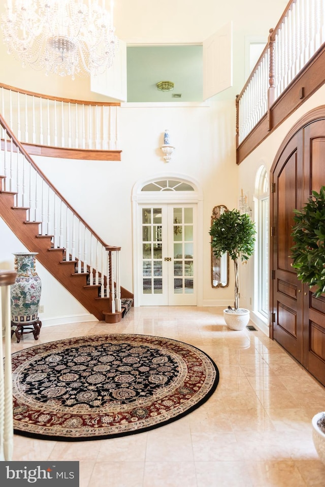 160 Fox Rd, Palmyra, PA 17078 - foyer featuring a high ceiling, french doors, stairs, a chandelier, and marble tiled flooring