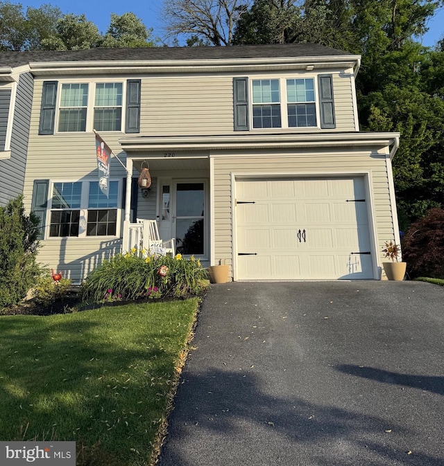 220 Cool Creek Way, Lancaster, PA 17602 - traditional home featuring a garage, asphalt driveway, and a front lawn