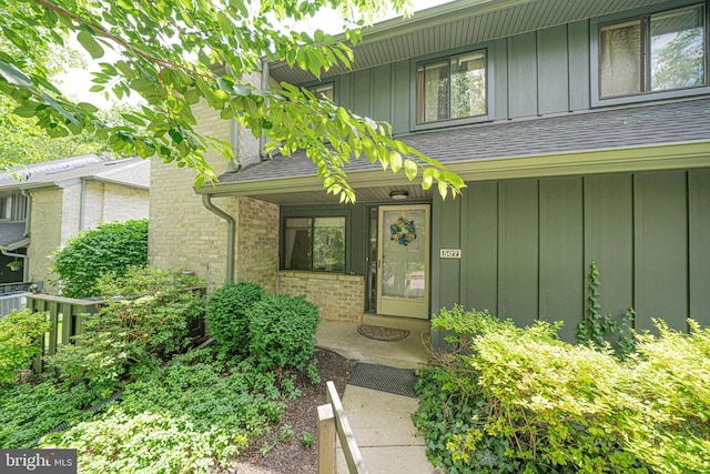 507 Foxwood Ln Unit 507, Paoli, PA 19301 - doorway to property featuring board and batten siding, brick siding, and a shingled roof