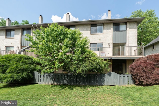 507 Foxwood Ln Unit 507, Paoli, PA 19301 - rear view of property featuring a chimney and brick siding
