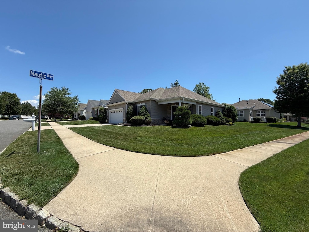41 Sunrise Bay Blvd, Little Egg Harbor Twp, NJ 08087 - view of home's exterior featuring an attached garage, a yard, and driveway