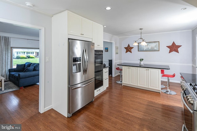 10 Camelia Ct, Lawrence Township, NJ 08648 - kitchen with stainless steel appliances, a kitchen breakfast bar, crown molding, white cabinetry, and dark wood-style floors