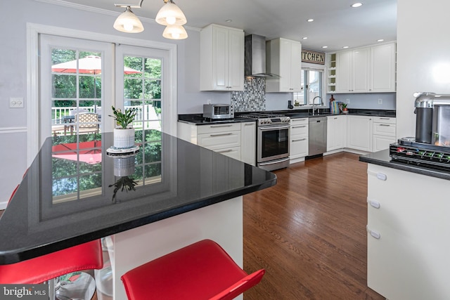 10 Camelia Ct, Lawrence Township, NJ 08648 - kitchen with appliances with stainless steel finishes, wall chimney exhaust hood, dark countertops, white cabinets, and recessed lighting