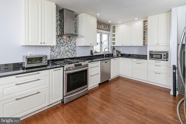 10 Camelia Ct, Lawrence Township, NJ 08648 - kitchen with stainless steel appliances, wall chimney range hood, open shelves, dark countertops, and dark wood-style flooring