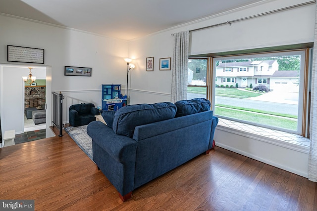 10 Camelia Ct, Lawrence Township, NJ 08648 - living area featuring crown molding, wood finished floors, and a chandelier
