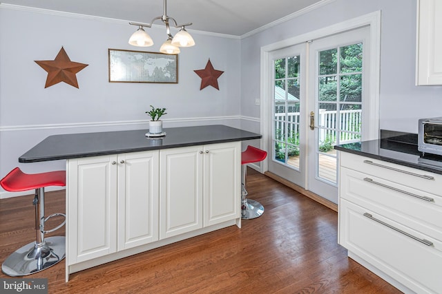 10 Camelia Ct, Lawrence Township, NJ 08648 - dining area with crown molding, dark wood-style floors, and french doors