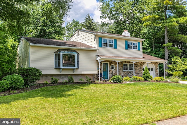 10 Camelia Ct, Lawrence Township, NJ 08648 - split level home featuring a chimney, a garage, a front yard, stone siding, and a porch