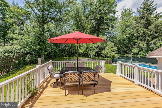 10 Camelia Ct, Lawrence Township, NJ 08648 - deck with outdoor dining space, a fenced backyard, and view of wooded area