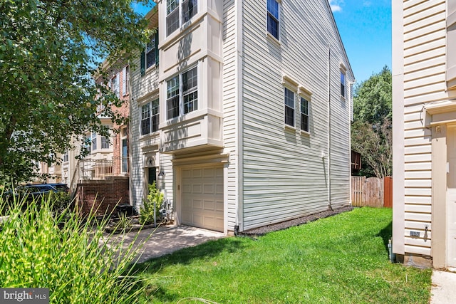 2508 Smoketree Ln, Crofton, MD 21114 - view of property exterior with an attached garage, a yard, and concrete driveway