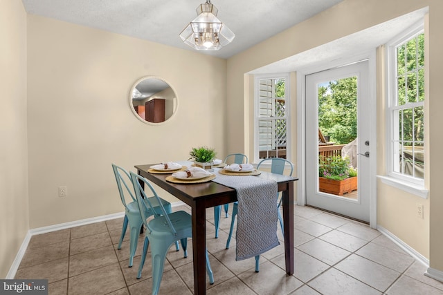 2508 Smoketree Ln, Crofton, MD 21114 - dining space with light tile patterned floors and a chandelier
