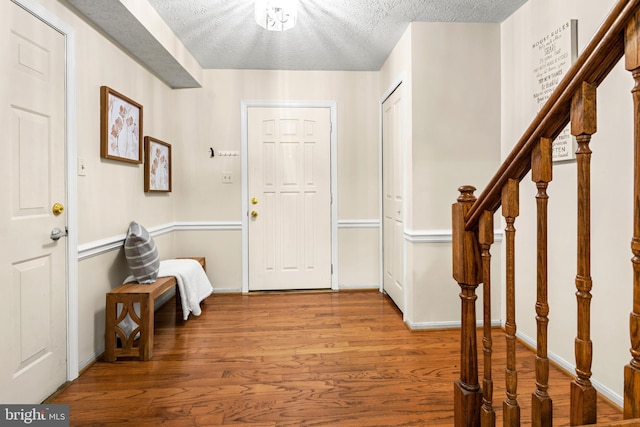 2508 Smoketree Ln, Crofton, MD 21114 - entryway featuring wood finished floors, stairway, and a textured ceiling