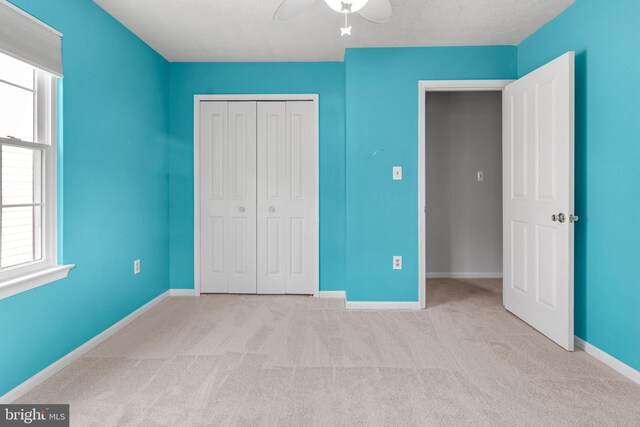 2508 Smoketree Ln, Crofton, MD 21114 - unfurnished bedroom with carpet floors, a closet, multiple windows, and a ceiling fan
