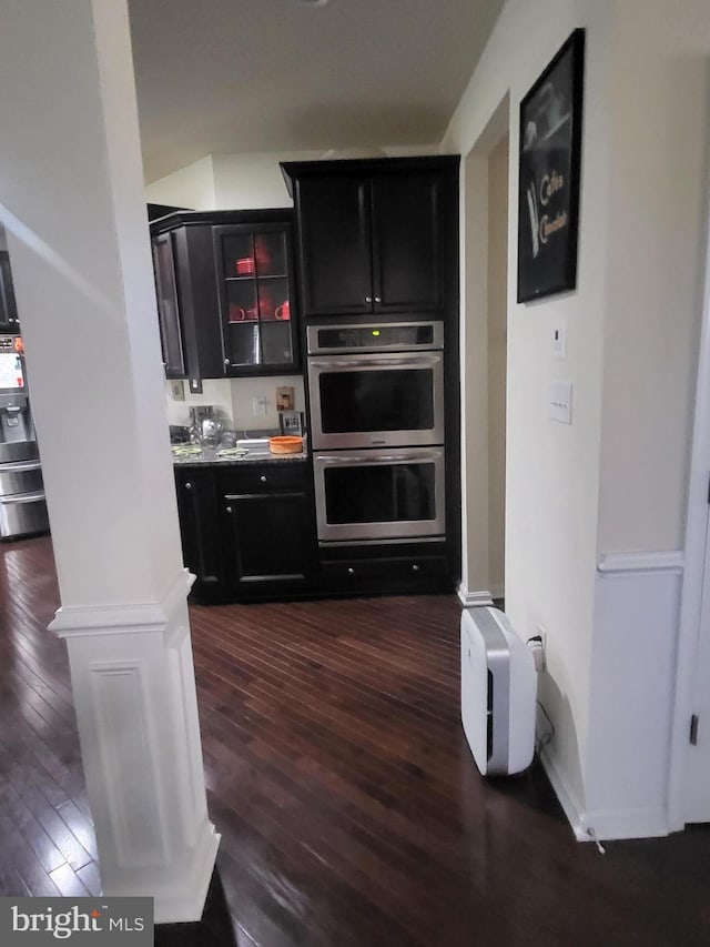 2511 Sir Michael Pl, Lanham, MD 20706 - bar area with stainless steel double oven, dark wood-type flooring, and refrigerator