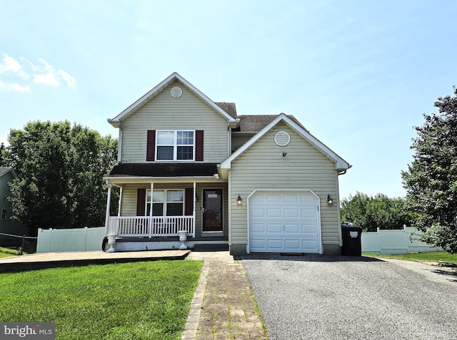 476 W Harvest Ln, Middletown, DE 19709 - traditional-style house featuring covered porch, gravel driveway, and a garage