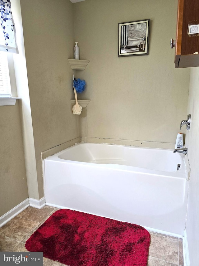 476 W Harvest Ln, Middletown, DE 19709 - bathroom featuring a bathtub and tile patterned flooring