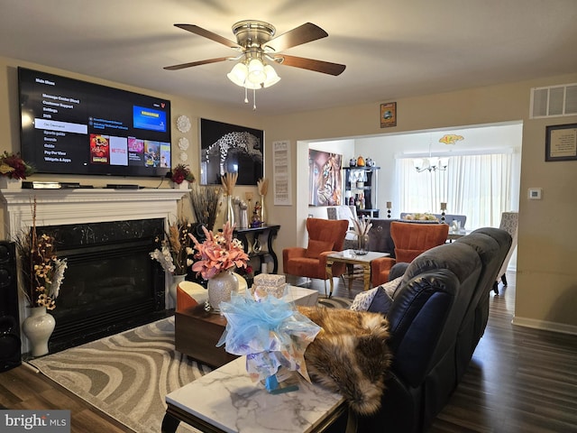 476 W Harvest Ln, Middletown, DE 19709 - living room featuring a chandelier, wood finished floors, ceiling fan, and a fireplace with flush hearth