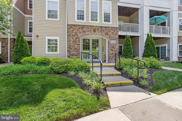 6000 Village Way Unit 308, Upper Chichester, PA 19061 - doorway to property with stone siding and french doors