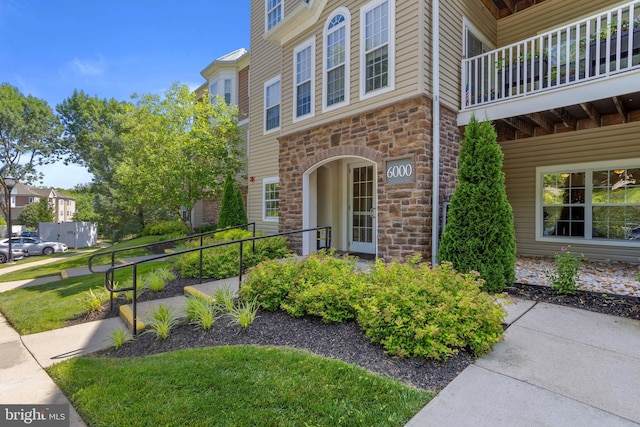 6000 Village Way Unit 308, Upper Chichester, PA 19061 - doorway to property featuring stone siding and a balcony