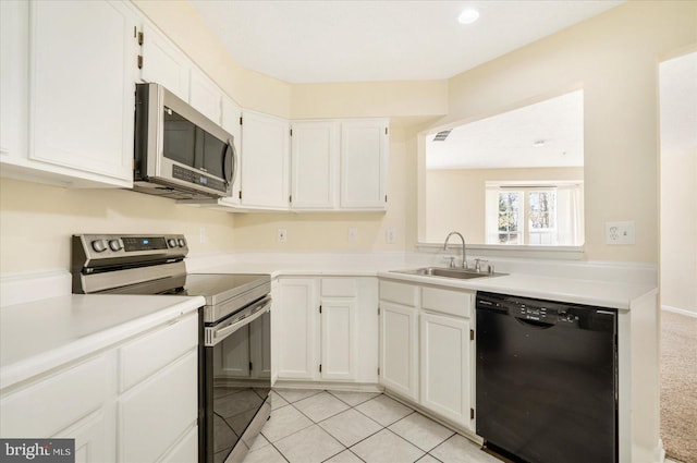 4260 Maple Path Cir Unit 15, Nottingham, MD 21236 - kitchen with appliances with stainless steel finishes, white cabinetry, light countertops, and light tile patterned floors