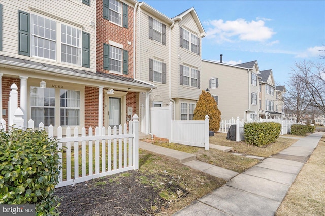 4260 Maple Path Cir Unit 15, Nottingham, MD 21236 - view of front facade with brick siding, covered porch, and a residential view