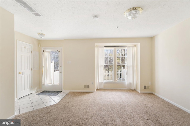 4260 Maple Path Cir Unit 15, Nottingham, MD 21236 - tiled foyer with carpet, healthy amount of natural light, and a textured ceiling