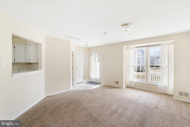 4260 Maple Path Cir Unit 15, Nottingham, MD 21236 - unfurnished living room with light carpet and a textured ceiling
