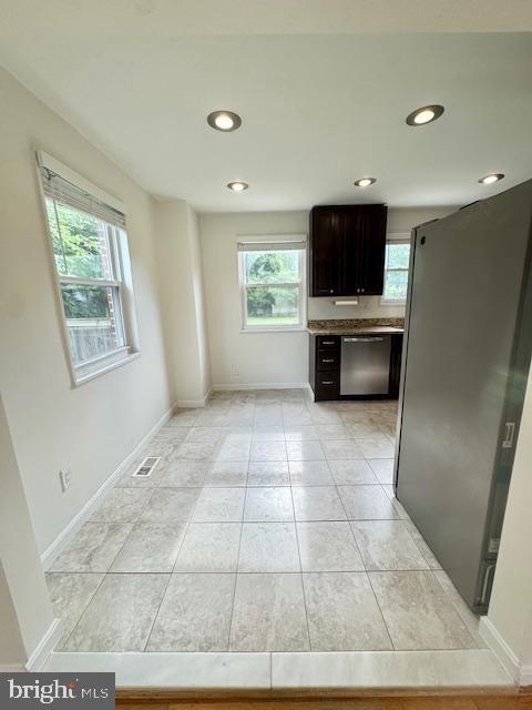 3814 Jancie Rd, Fairfax, VA 22030 - kitchen with appliances with stainless steel finishes, recessed lighting, light tile patterned floors, and dark brown cabinetry