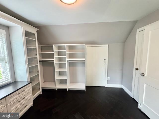 3814 Jancie Rd, Fairfax, VA 22030 - unfurnished bedroom featuring dark wood-style floors, vaulted ceiling, and a closet