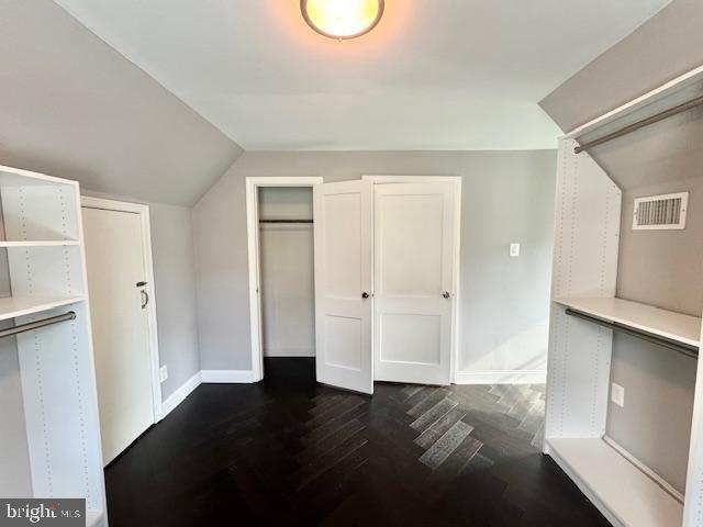 3814 Jancie Rd, Fairfax, VA 22030 - bonus room with vaulted ceiling and dark wood-style flooring