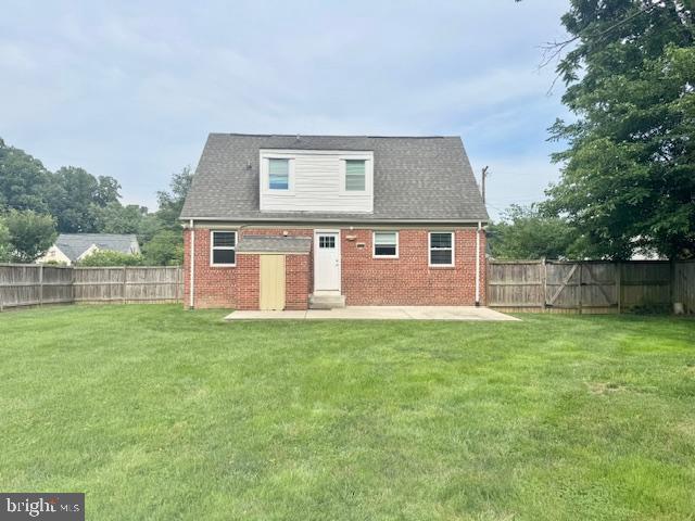 3814 Jancie Rd, Fairfax, VA 22030 - back of house with a fenced backyard, brick siding, and entry steps