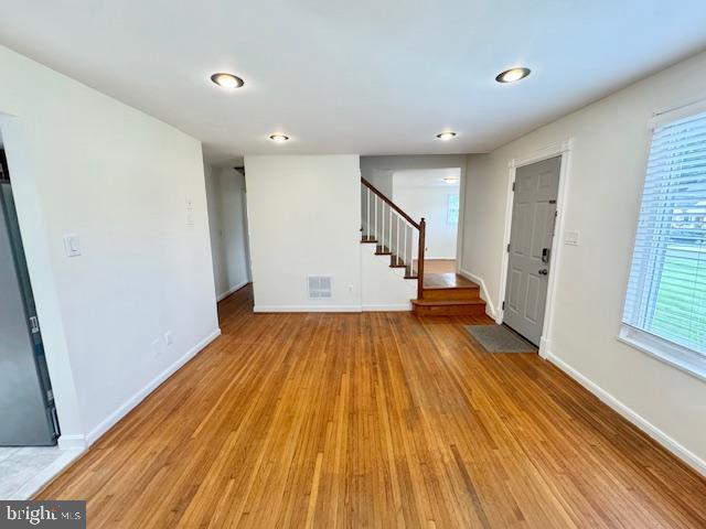 3814 Jancie Rd, Fairfax, VA 22030 - foyer entrance with light wood-style flooring and stairway