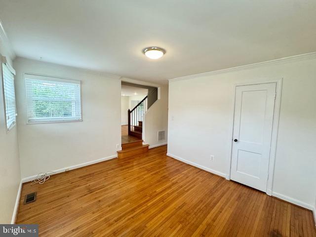 3814 Jancie Rd, Fairfax, VA 22030 - unfurnished room with wood finished floors, stairs, and ornamental molding
