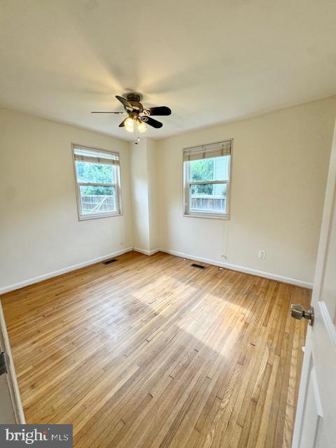 3814 Jancie Rd, Fairfax, VA 22030 - unfurnished room with healthy amount of natural light, light wood-type flooring, and ceiling fan