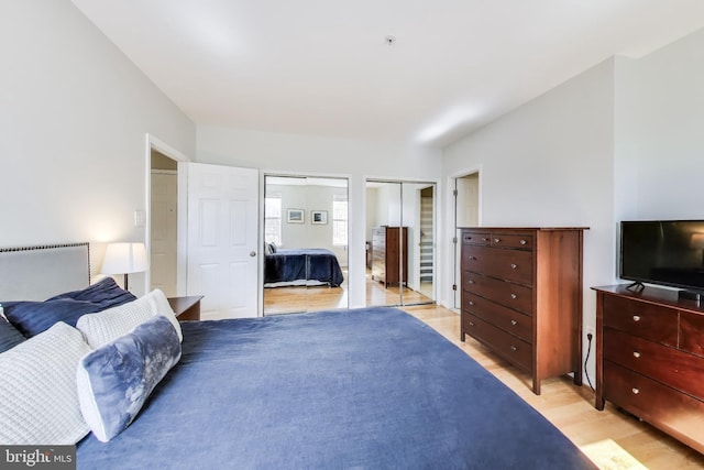 1619 R St NW Unit 501, Washington, DC 20009 - bedroom featuring light wood-style flooring and two closets