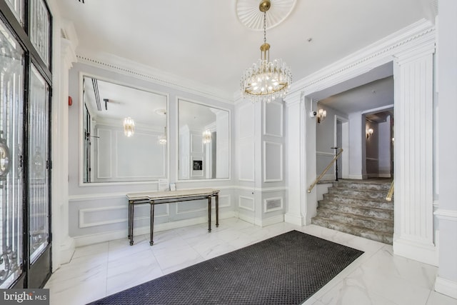 1619 R St NW Unit 501, Washington, DC 20009 - foyer with marble tiled flooring, a decorative wall, a chandelier, stairway, and ornamental molding