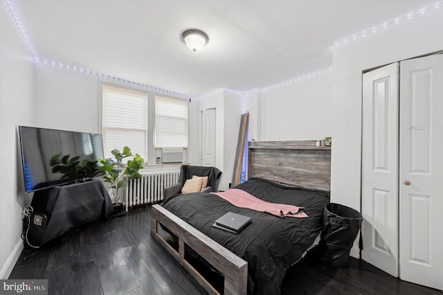 2467 79th Ave, Philadelphia, PA 19150 - bedroom with radiator heating unit and wood finished floors